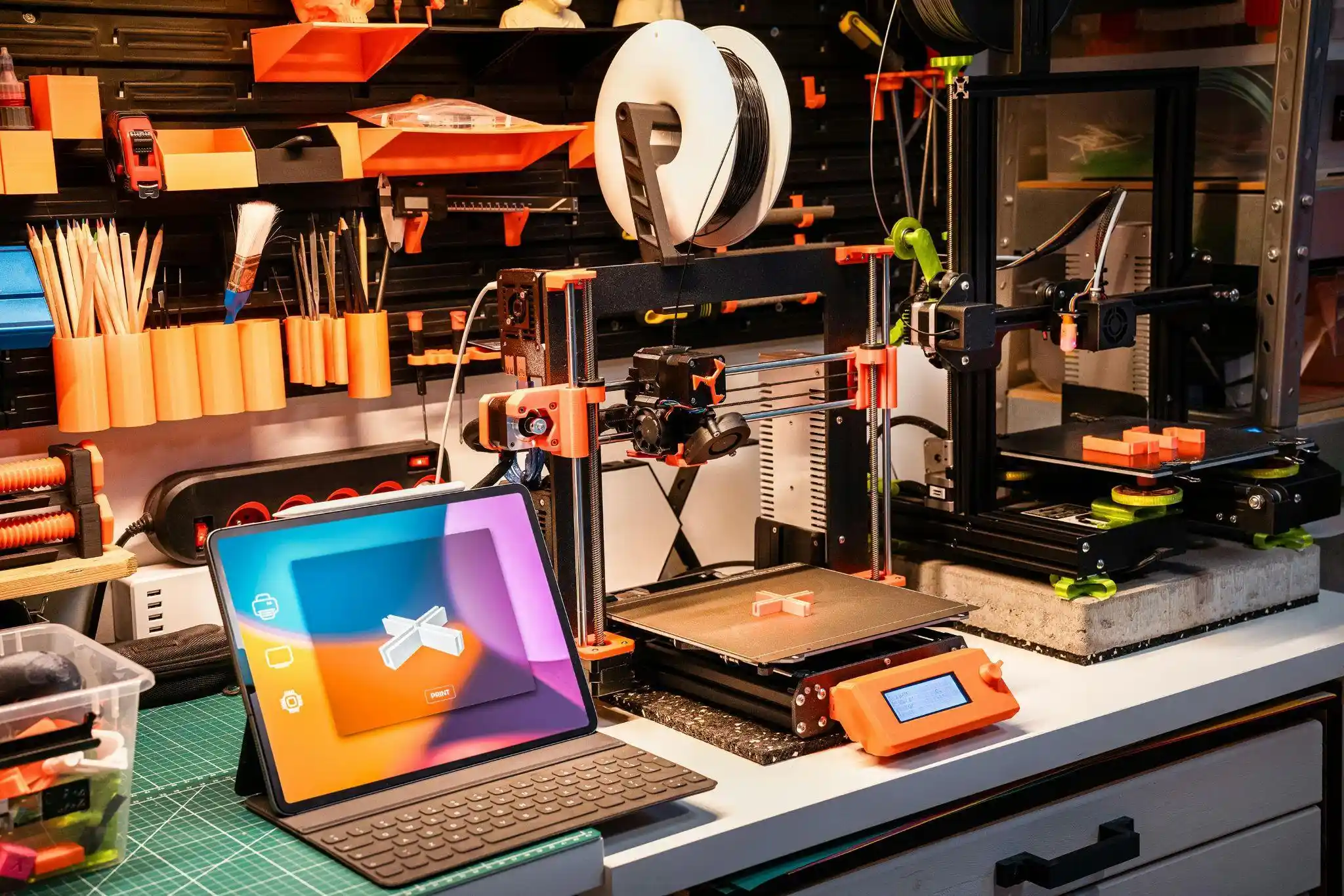 laptop and 3d printer on desk