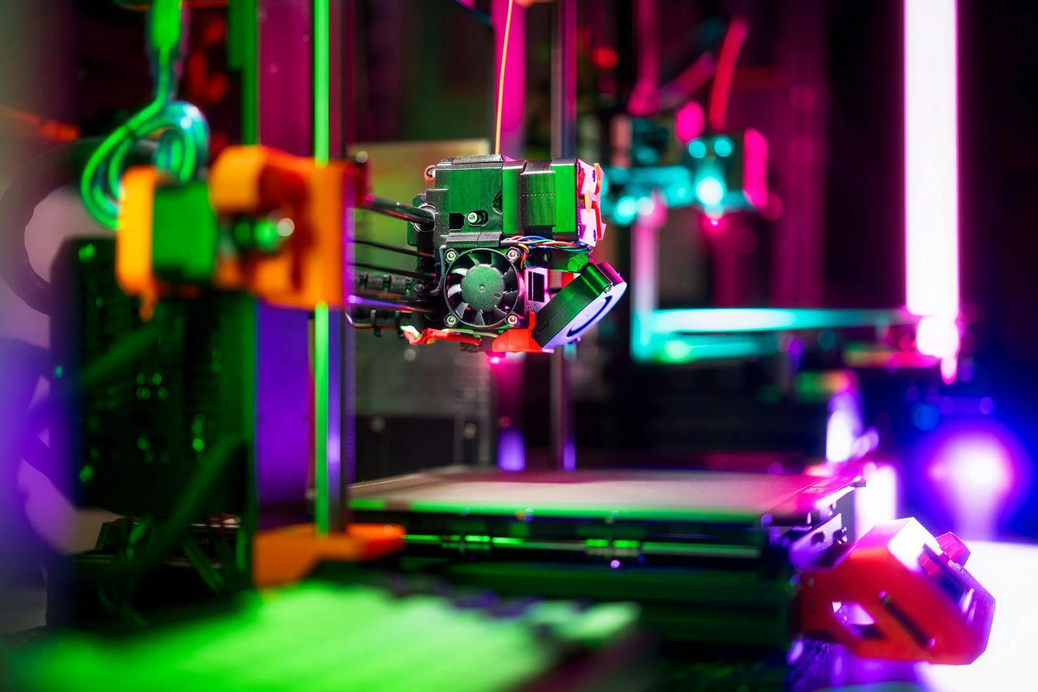 vibrant neon 3d printer in action close up